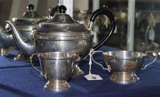 A 1930s silver three piece silver tea set, gross 27 oz.